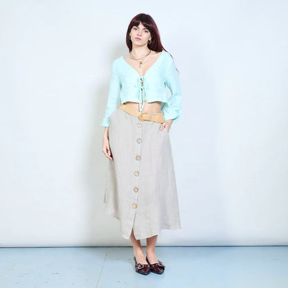 Blusa corta con scollo a V e chiusura con laccetti