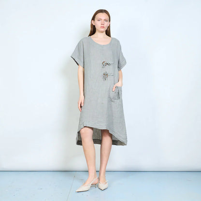 Abito donna ampio con laccetti decorativi e tasca