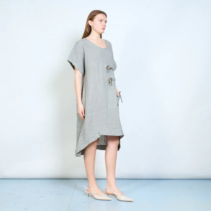 Abito donna ampio con laccetti decorativi e tasca